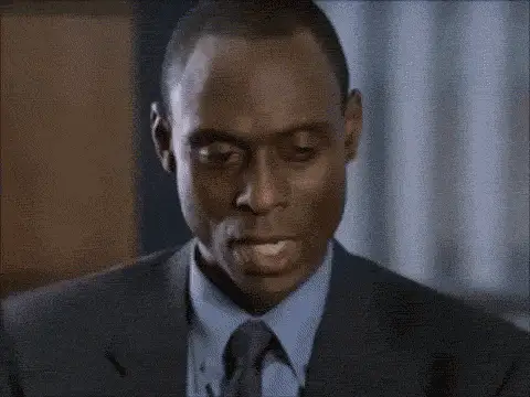 GIF: Mann im Anzug blickt skeptisch zur Seite